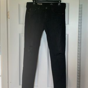 Destroyed black AG skinny jeans
